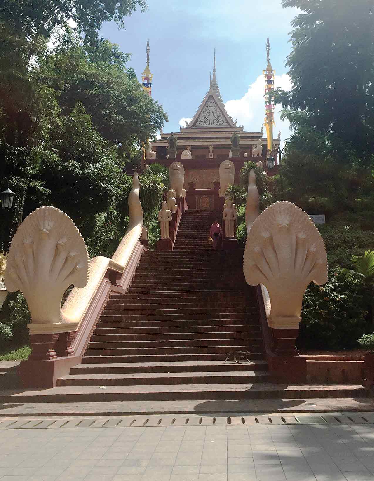 Main stariway leading to the temple’s entrance guarded by statues of baton-wielding warriors, nagas, and lions. Photo by Keith Lehman.
